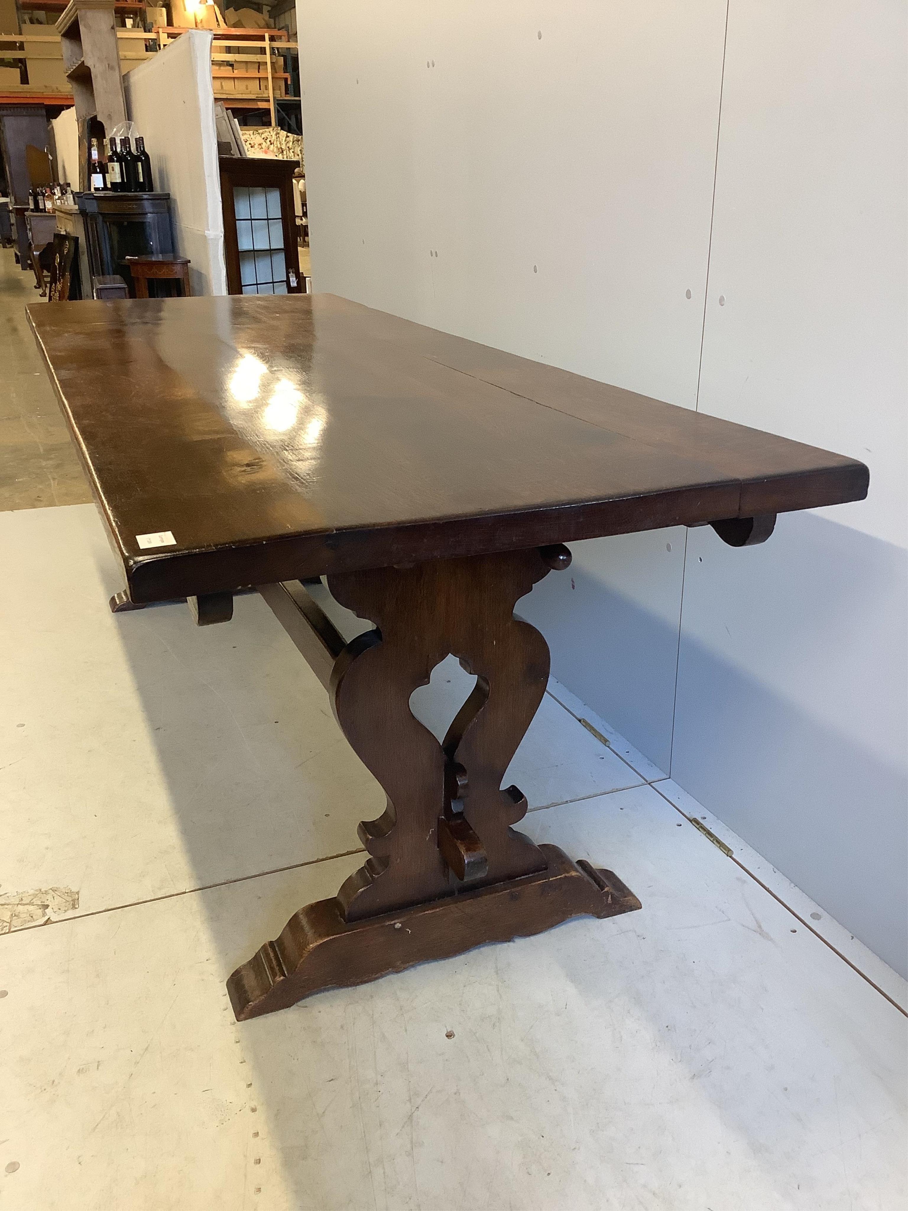 An 18th century style rectangular oak refectory dining table, width 222cm, depth 83cm, height 76cm. Condition - fair